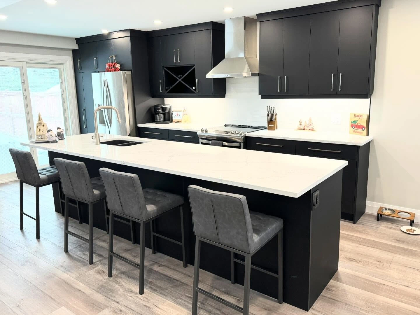 Charcoal kitchen and seating island by LG Woodworking