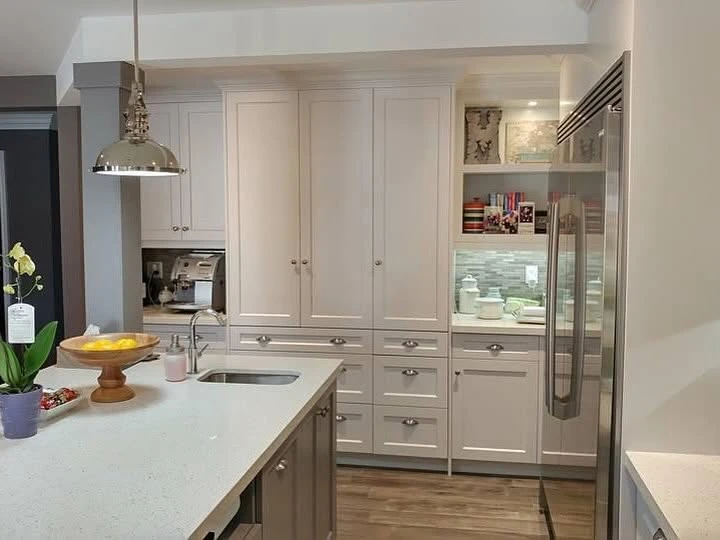 Traditional white kitchen storage wall by LG Woodworking