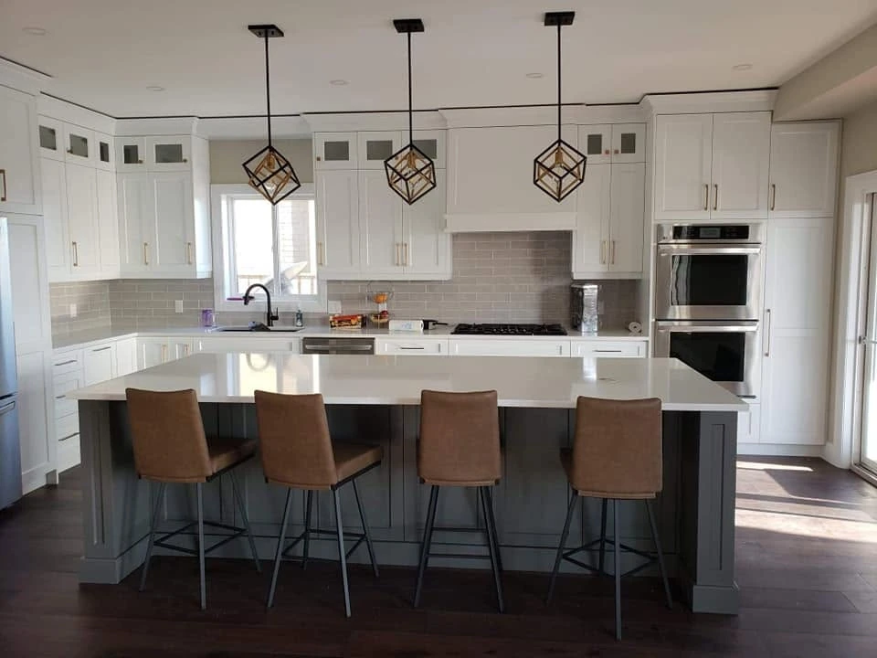 White kitchen with grey island by LG Woodworking