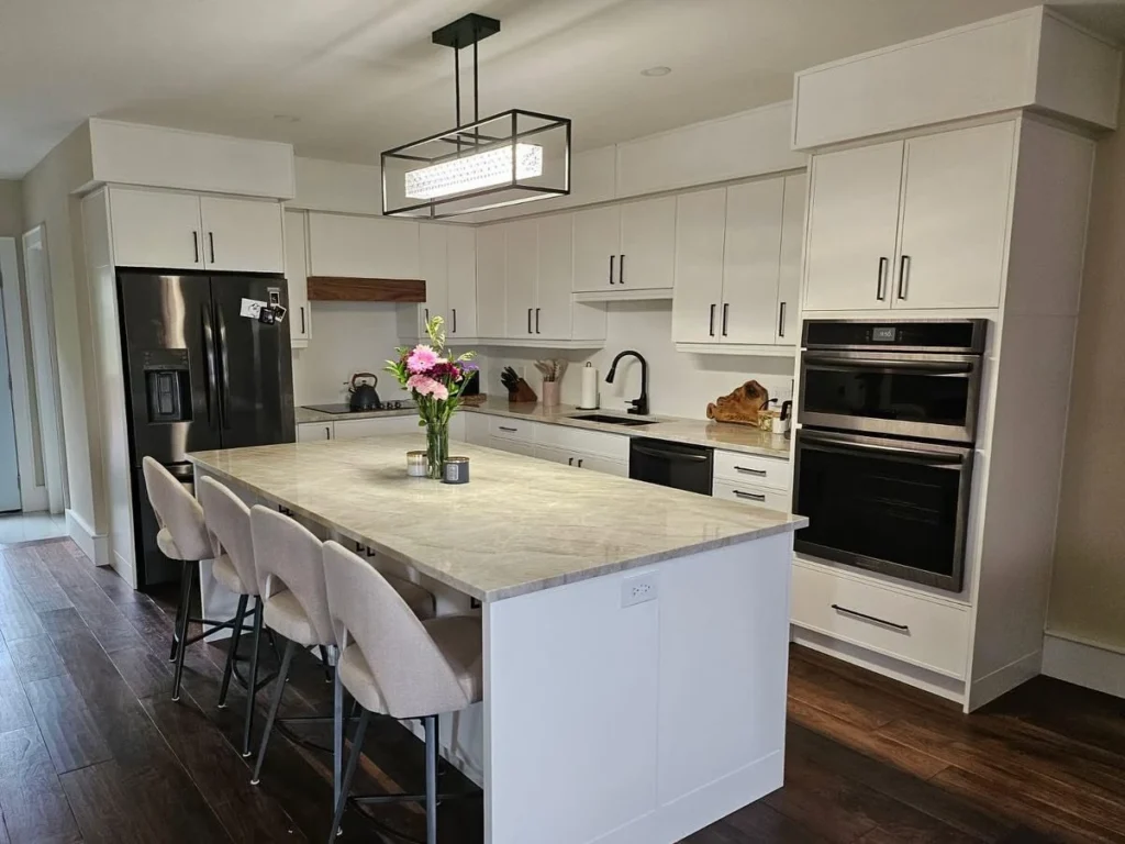 White island kitchen with black accents by LG Woodworking