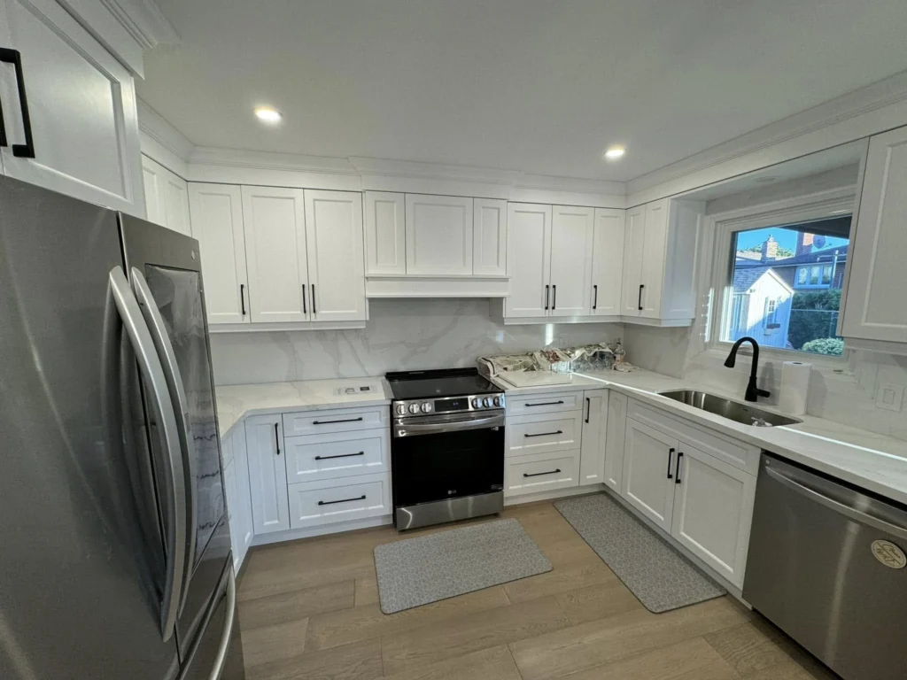 White kitchen with corner window by LG Woodworking