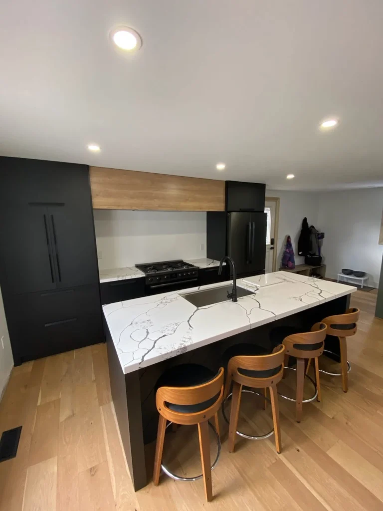 Charcoal kitchen with timber hood detail by LG Woodworking
